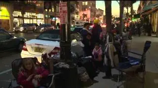 People camp out on Pasadena sidewalks to watch Rose Parade