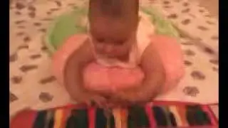 Suzuki method: Baby (4 months old) playing with colored keys