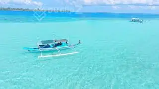 Drone Footage of Balabac -  Aerial View of Balabac&rsquo;s Clear Ocean and Island Sandbanks with Boat