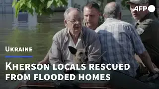 Kherson locals flee flooded homes after Ukraine dam destroyed | AFP