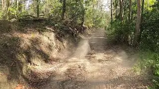 Chasing Kaz along a 4WD track.