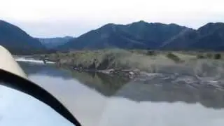 Bearhawk takeoff on riverbed