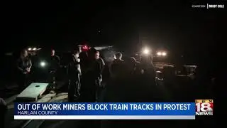 Out of work miners block train tracks in protest