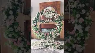 Pretty in Pink Ceremony Room Design with Arch, Chandelier, Hanging Globe Candles and Signing Table