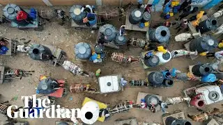 Gaza: drone footage shows people lining up at water station