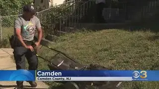 Camden County police officers mowing lawns for a good cause