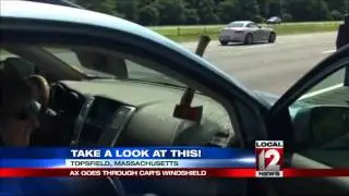 Hatchet flies off truck, through car windshield