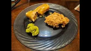 Chicken burritos with a cream sauce.
