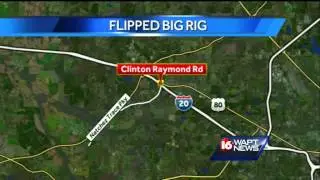 Truck overturns on Clinton-Raymond Road