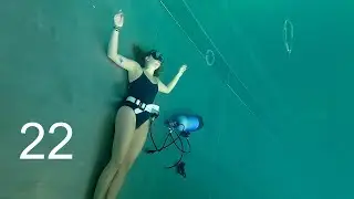 Girl Making Bubble Rings Underwater in Indoor Pool - AC25 *weights*Scuba Tank*