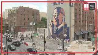 John Lewis mural becomes place for people to pay their respects