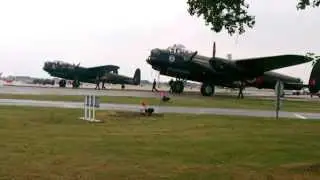 CWH Avro Lancaster KB726 C-VRA Vera passes by her sister at RAF Coningsby