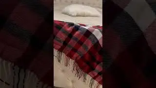 Transforming your space into a cozy Christmas haven with this Red Buffalo Plaid Throw.