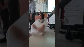 Vacuum sealing a girl in a garbage bag during sci. Class