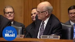 Sen. Pat Roberts (R-Kan) offers Sen. Ron Wyden a Valium pill - Daily Mail