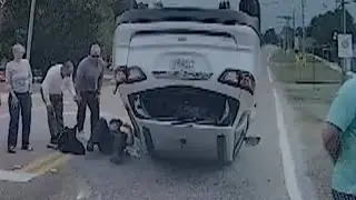 Officer Rescues Teenage Sisters Trapped In Overturned SUV