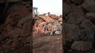 LOADER RESCUES VEHICLE FROM ROCKY GRAVEVEHICLE STUCK IN STONE LOADER TO THE RESCUEEPIC LOADER SKILL