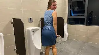 Lulu went to the men's room on the roof of the hotel at night to get wet. Crazy wetlook video.