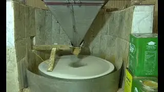 A Kurdish factory in Duhok uses the traditional grinder to crush the sesame seeds to produce tahini