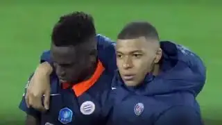 Mbapp&eacute; consoling Junior Sambia, the player who missed the decisive penalty for montpellier.