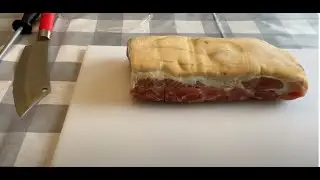 Cold smoking dry-cured bacon in a cardboard box.