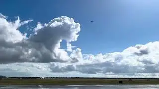 RC Plane Takes off and Flies Doing cool tricks in the air at Ellington airport during a Airshow.
