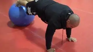 Decline push ups on stability ball