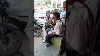 ear cleaning in Road side ..