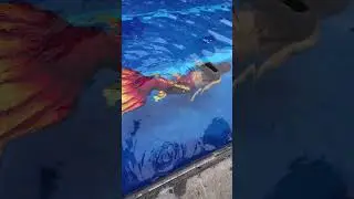 Red mermaid in a pool