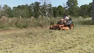 Scag taking down tall grass
