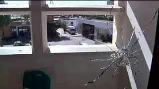Libya security building hit in rival militia clashes