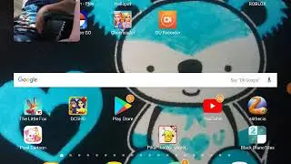 Sebastian plays a game on my tablet. The wonderful gaming sisters.