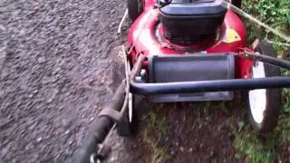 2004 SEARS push mower mowing a ditch #1