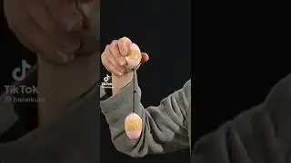 two plastic easter eggs filled with mung beans , original video in desc
