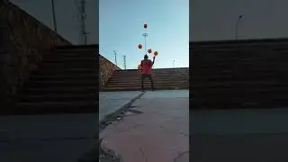 man shows impressive juggling skills with balls and bowling pins - 1482148