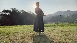 Early morning martial arts practice. The sun rises over Japan.