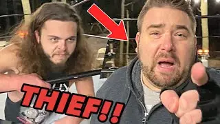 a wrestler is stealing from me ...