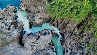 Waterfall with uniquely sculpted rocks formed by years of water erosion. 🏕️ (Kapila River) ✨