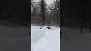 Ford tractor plowing snow