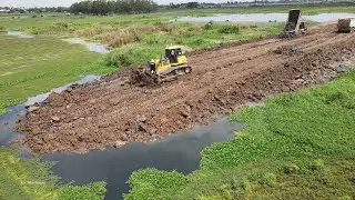 Great Best Road Construction Across Big Lake Power Dozer Pushing Dirt Vs Dump Truck Unloading Dirt