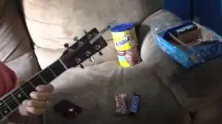 Bro Byrl playing Roberto's guitar while he is working