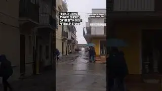 People fleeing as wave crashes on street in Sicily after sea storm