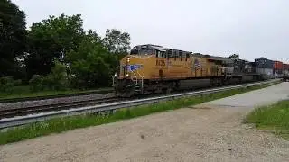 UP 8136 and NS 9853 lead a stack train east through Elburn IL