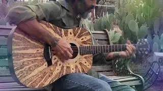 Soundchecking a Woodburned Guitar