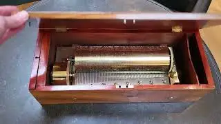 A fine Swiss walnut two per turn cylinder music box with key winding made circa 1845