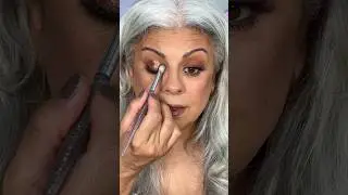 Brown makeup and glitter on my mature eyes