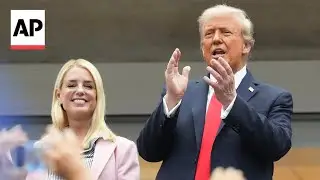 Trump receives a mix of cheers and boos as he attends the US Open