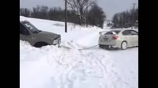 STi pulls a ford out of the snow(EPIC)