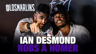 Desmond leaps at the wall to rob a home run