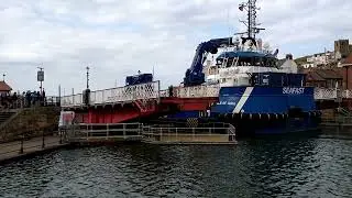 Speeded-up view of Isle of Jura and Summer Queen passing through Whitby Swing Bridge in June 2022